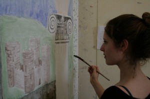 Babson student Amy Dwarnick puts the finishing touches on a fresh layer of plaster, continuing a 2,000 year-old Italian tradition of buon fresco, for their class in Fresco at the Umbra Institute in Perugia. 