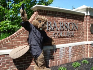 Babson's Biz-E-Beaver in the eco-friendly cap and gown.