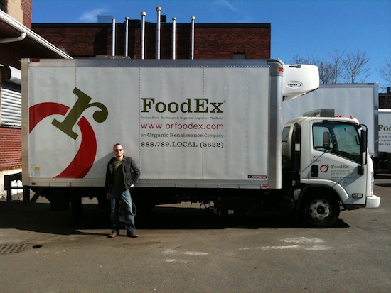 JD in front of a FoodEx truck. Photo Credit: Seedstock.