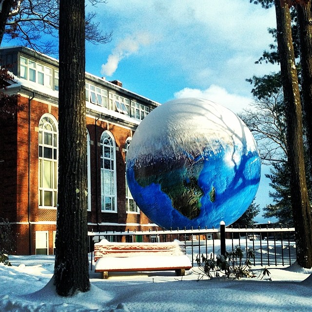 Snow covers the globe on Babson's campus.